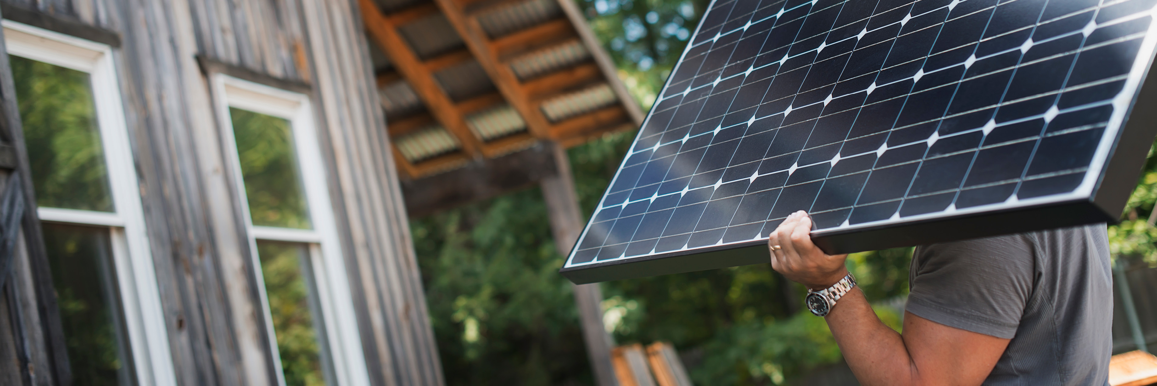 Man holding solar panel