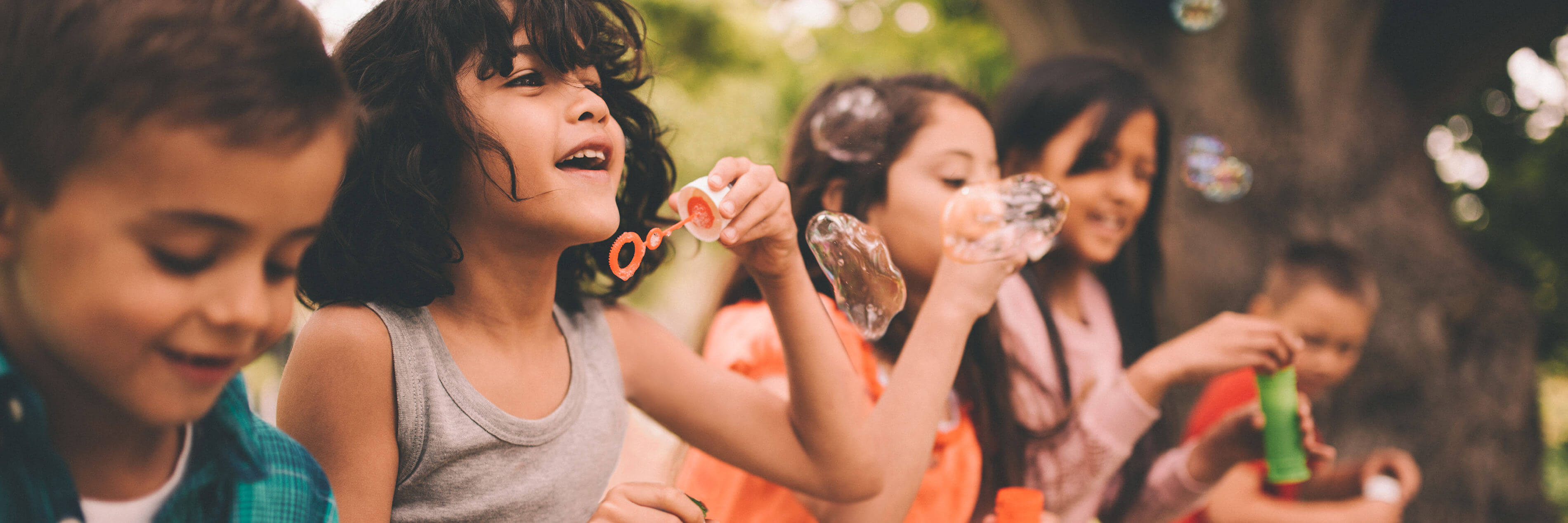 Kids blowing bubbles