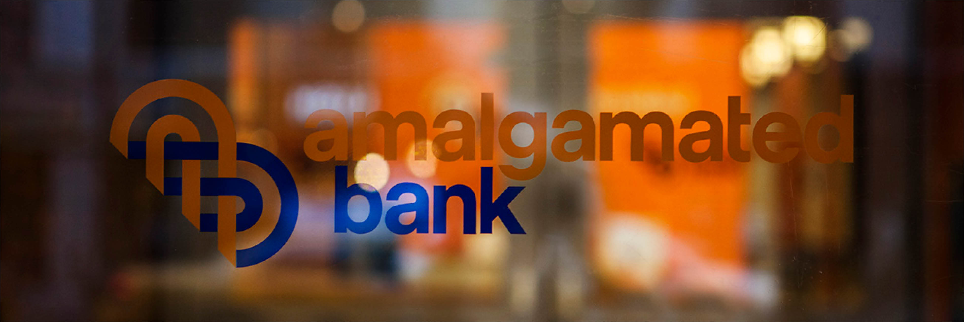 photo of amalgamated bank logo on glass