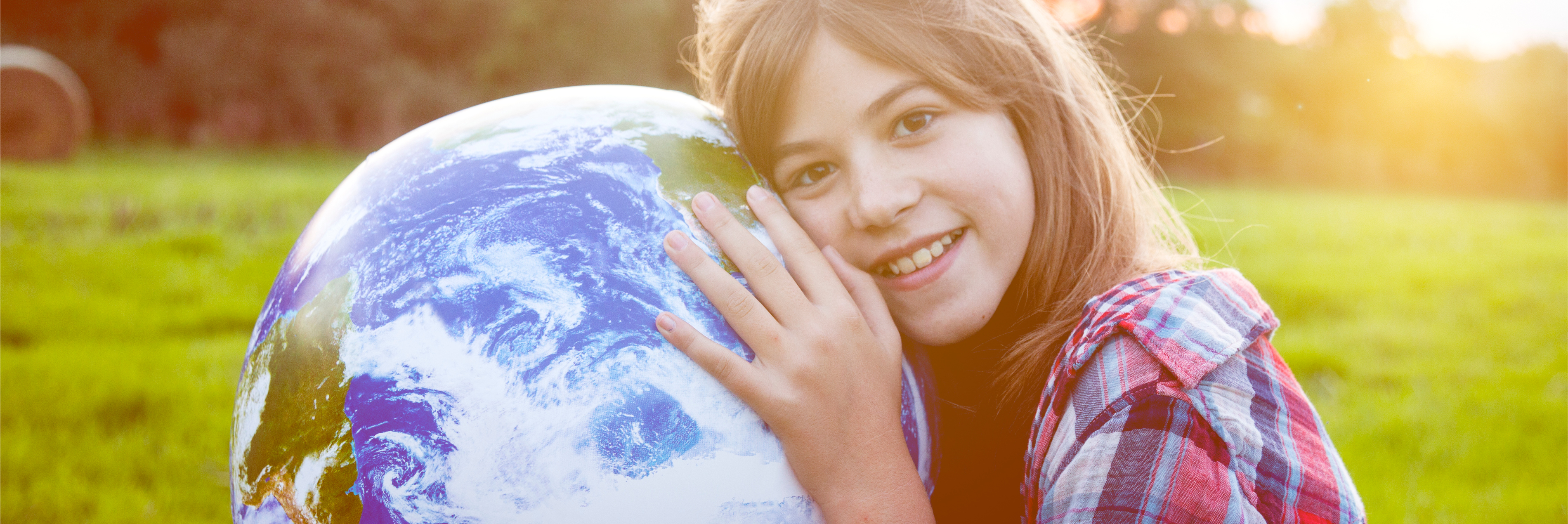 Girl hugging globe