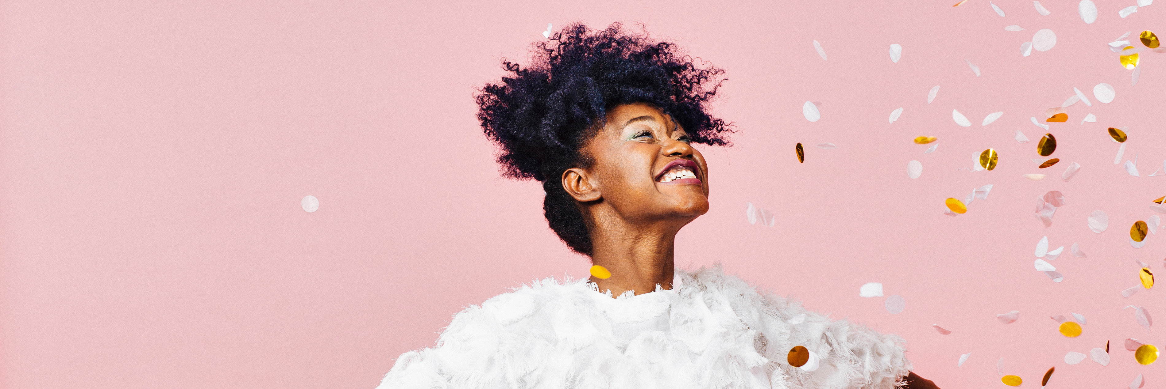 Woman celebrating with confetti