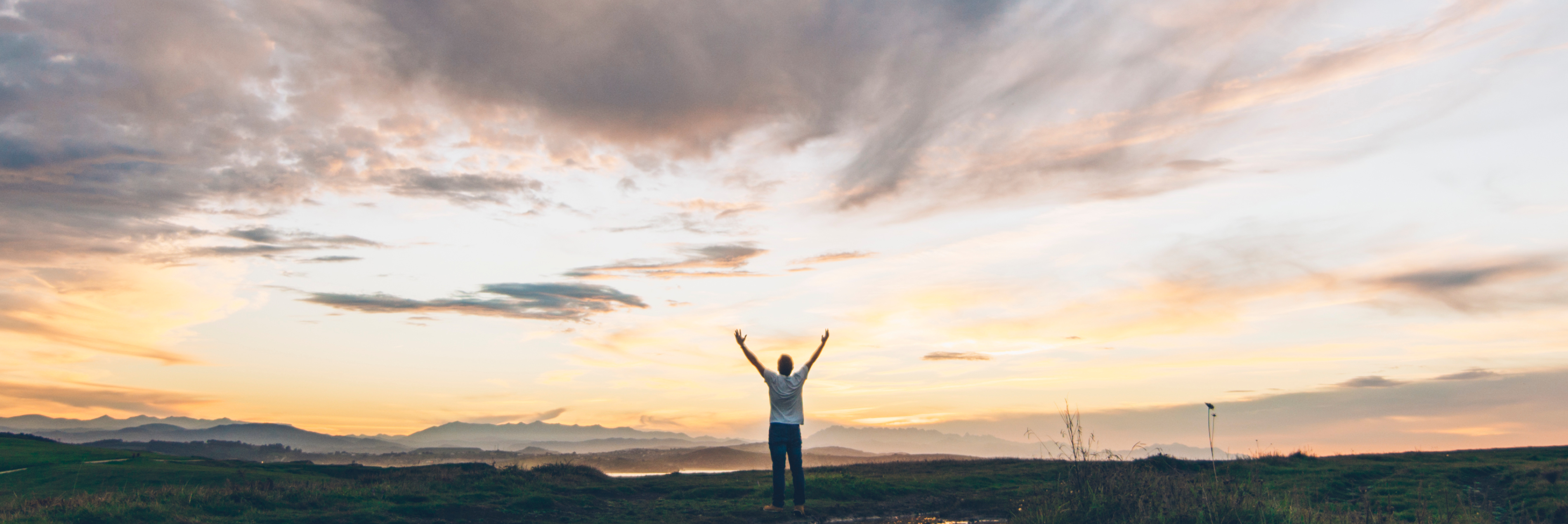 Man with arms raised