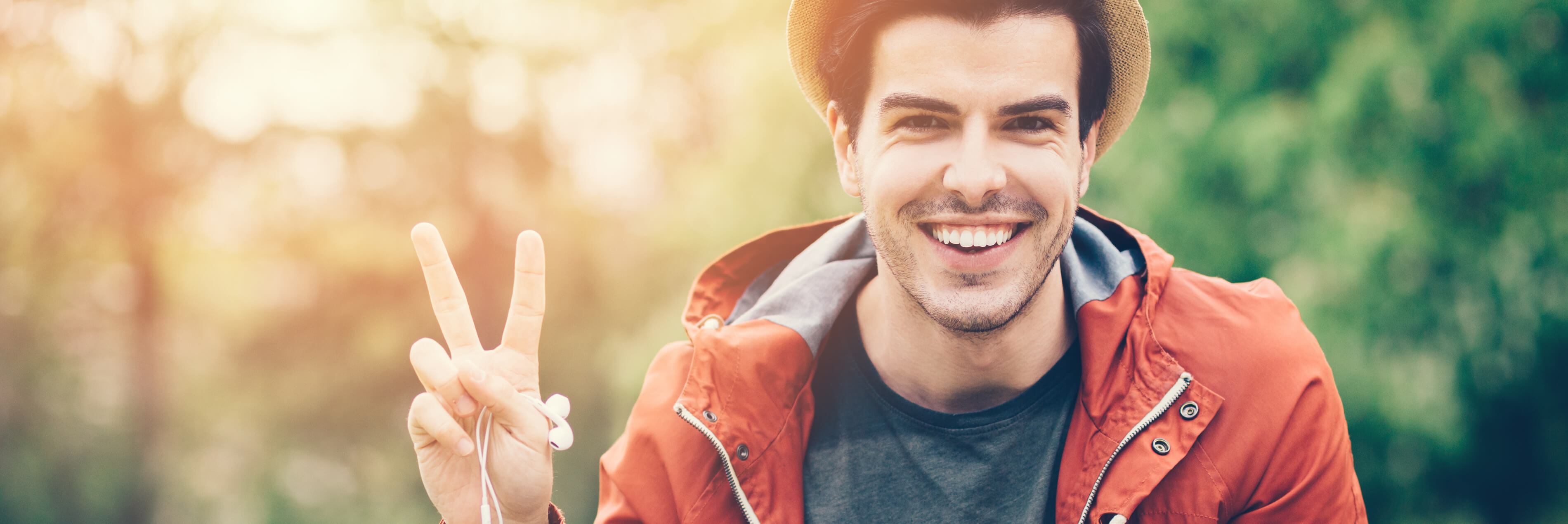 Man making peace sign gesture