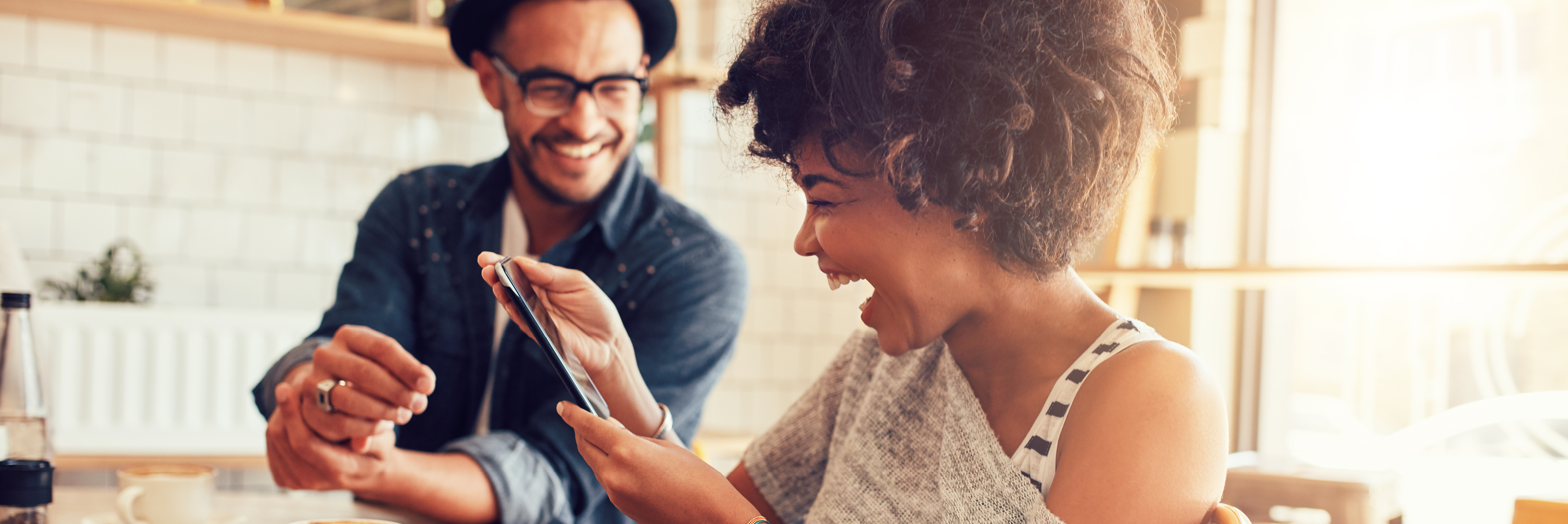 Friends smiling looking at phone