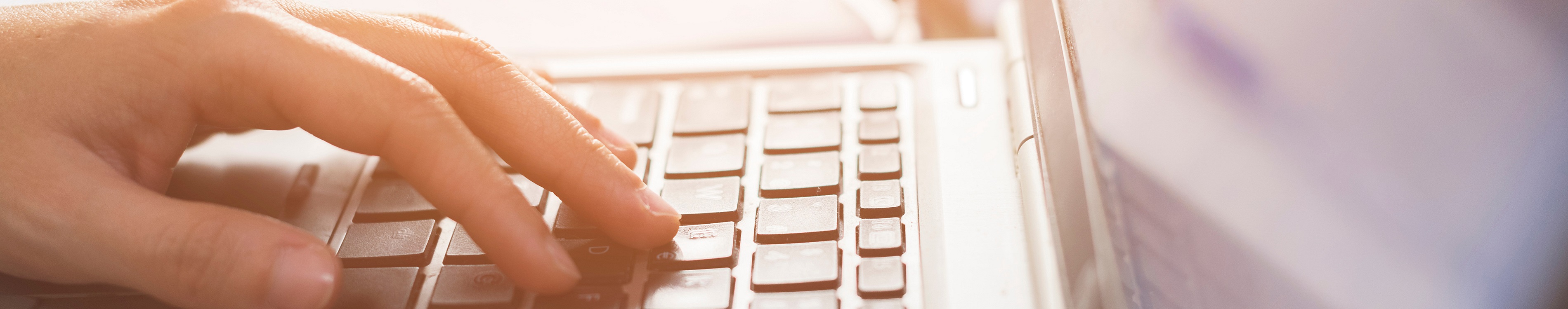 hand on computer keyboard