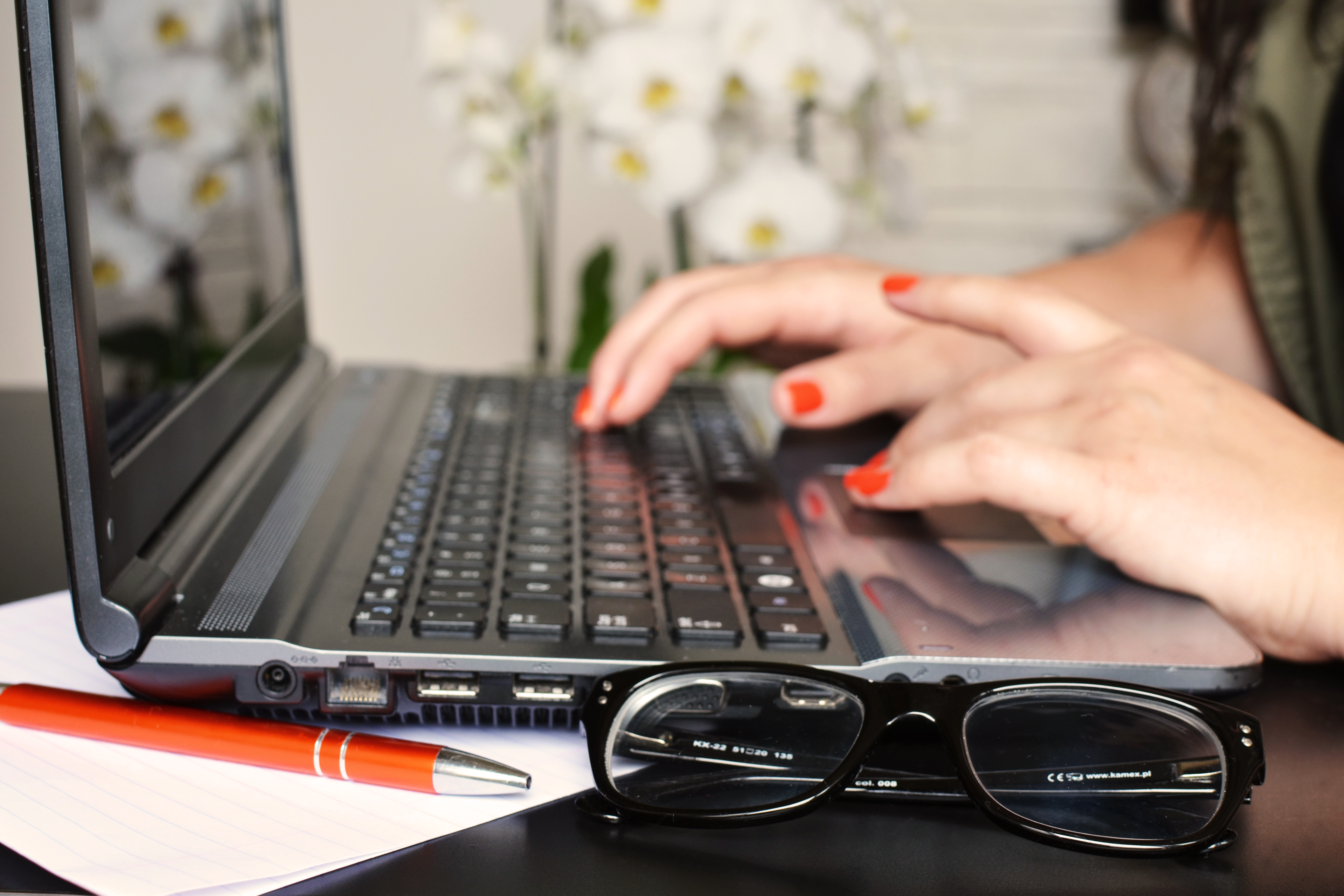 person typing on laptop 