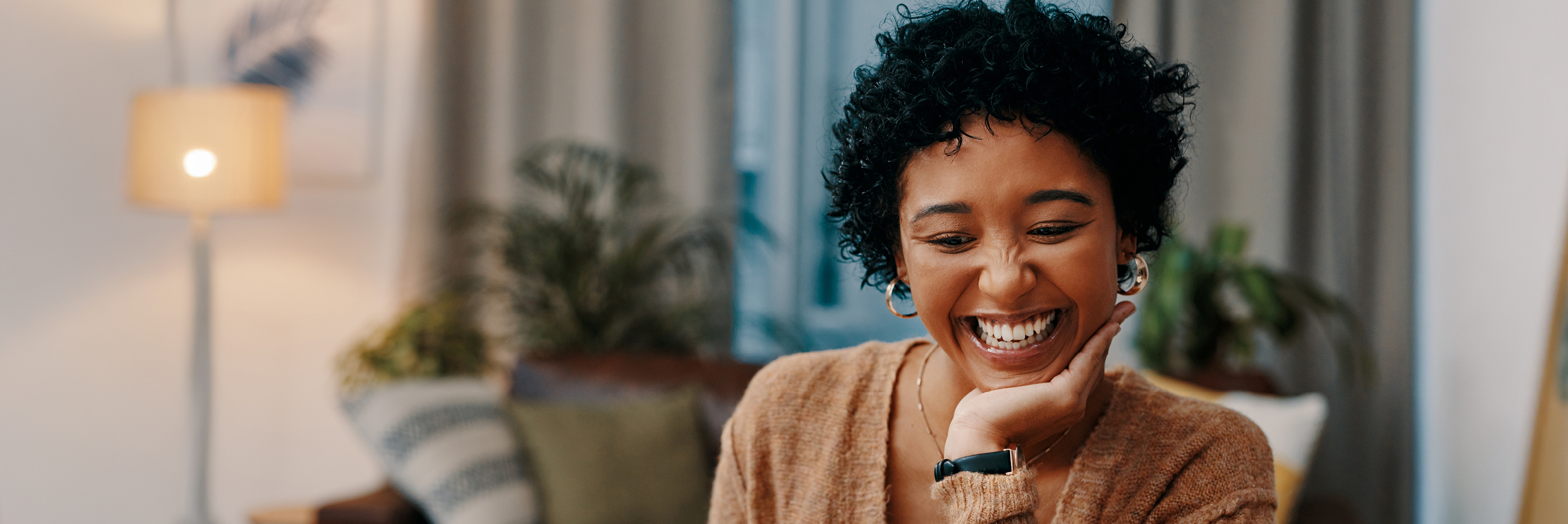 Woman smiling with hand on her chin