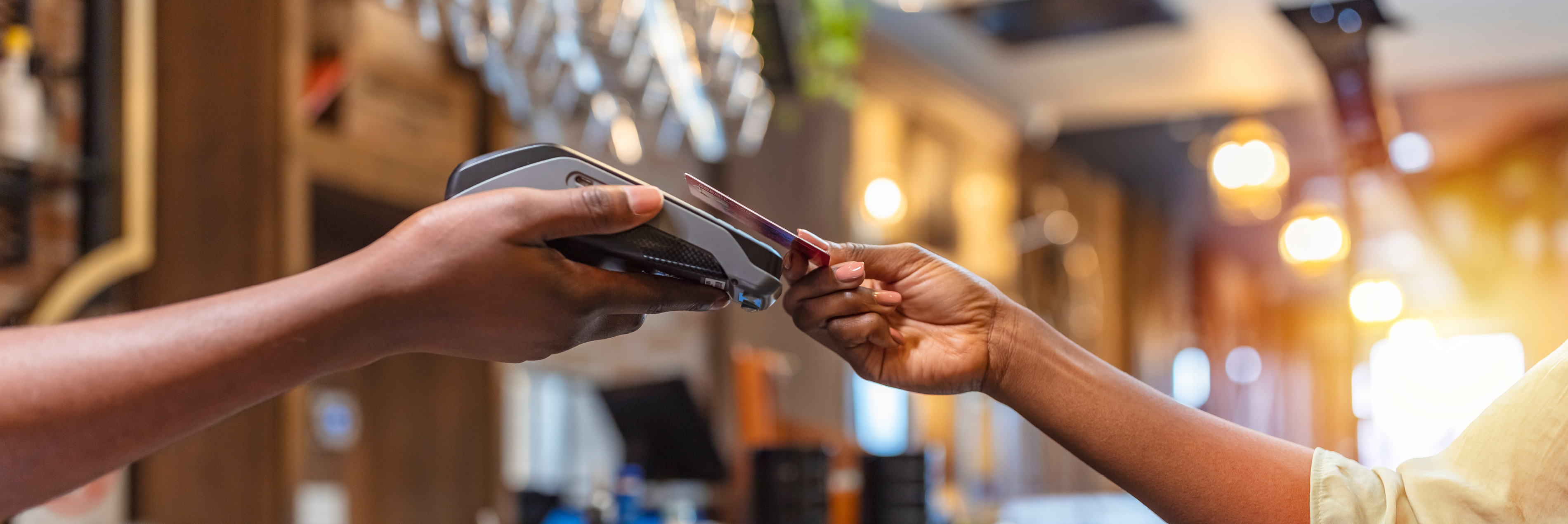 Person tapping credit card