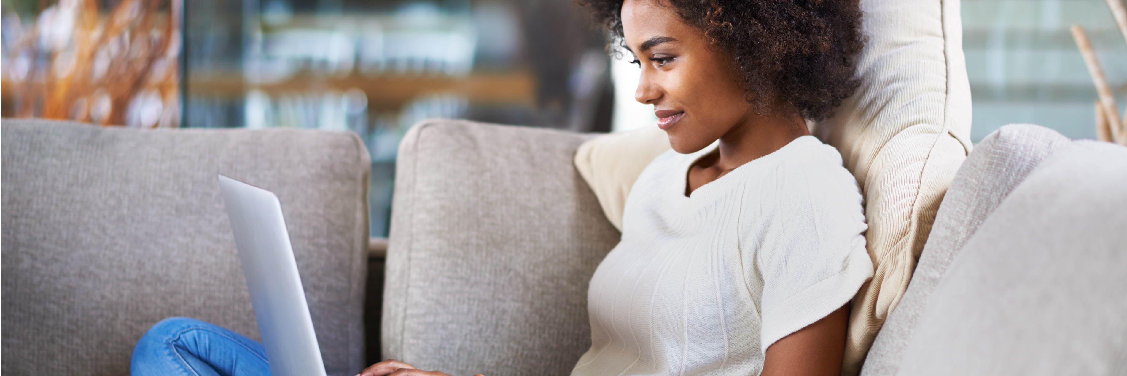 Woman on couch with laptop