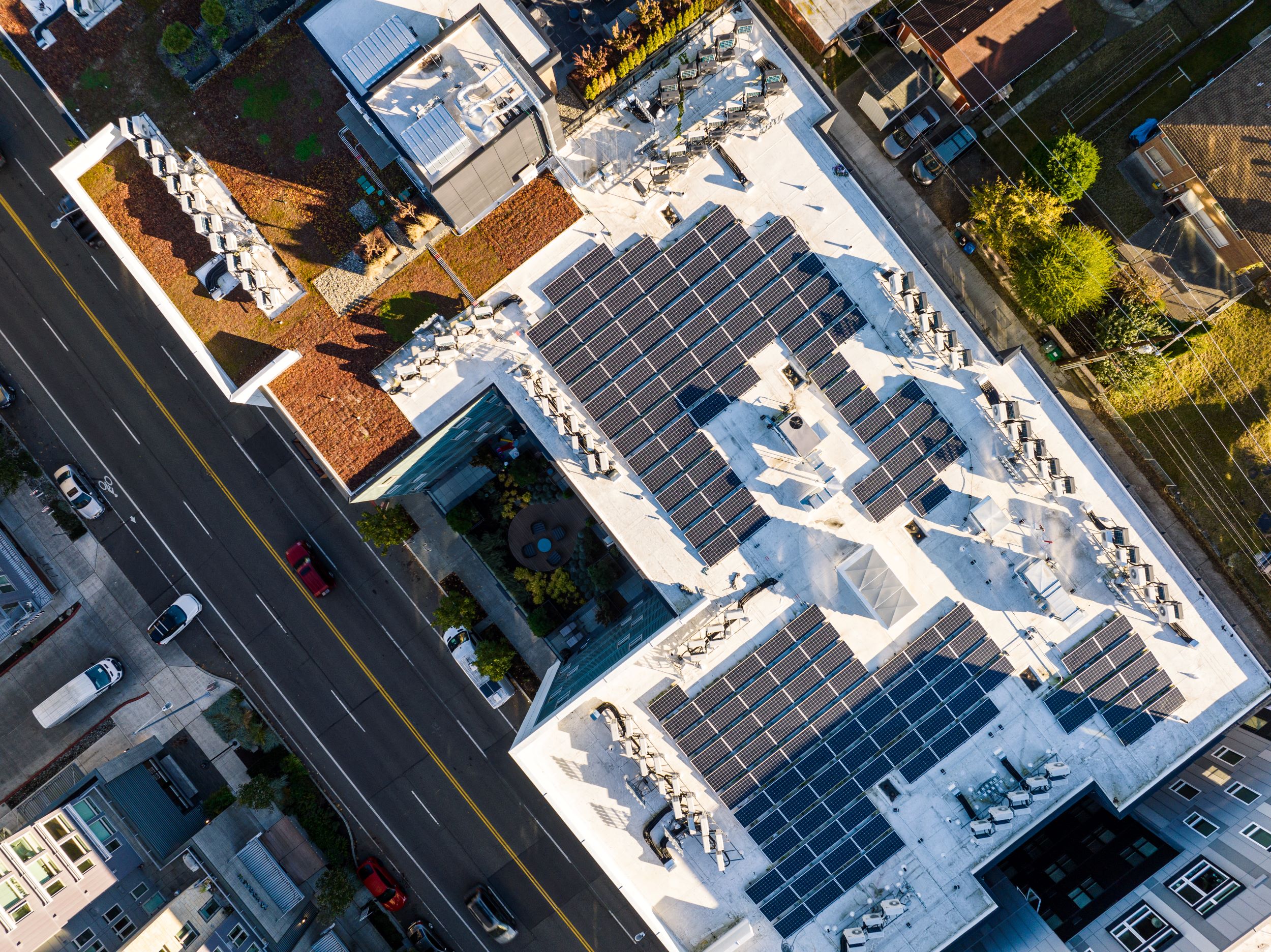 Aerial view of solar panels on rooftop of commercial building