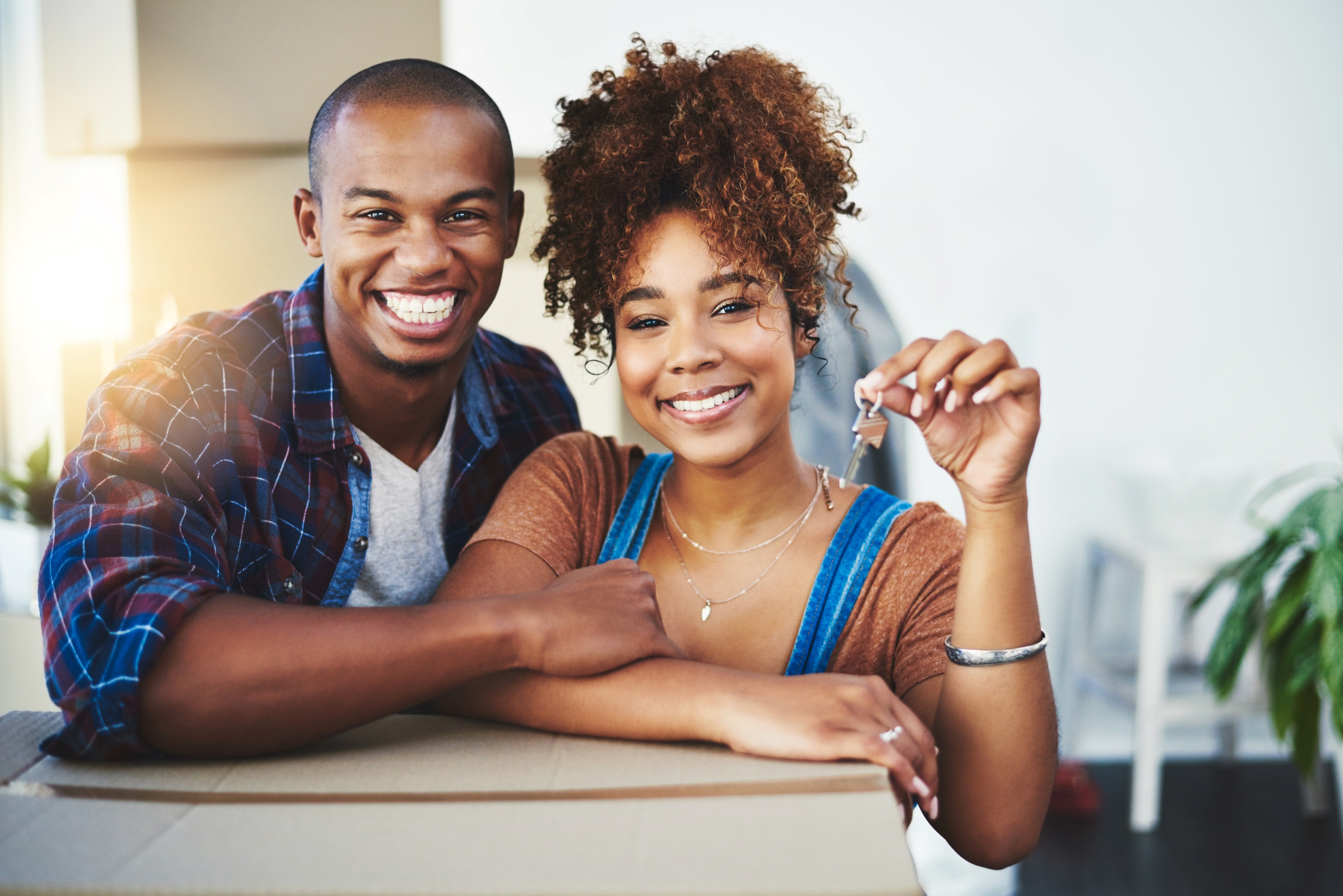 Young couple holding house keys