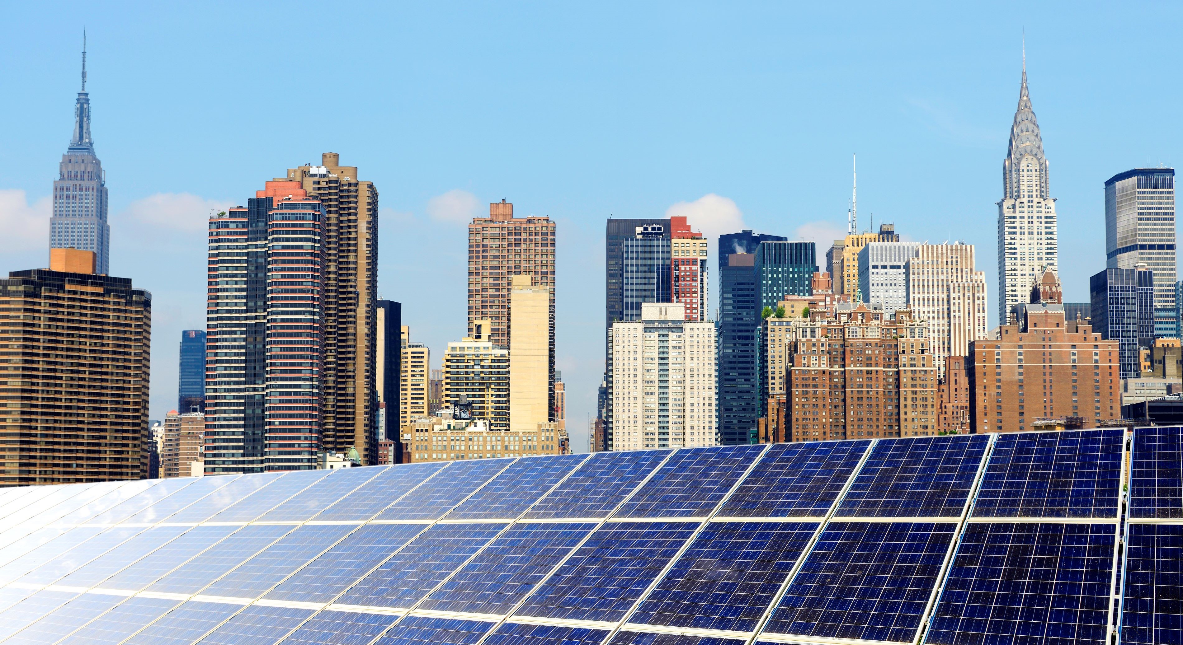 Solar panels with commercial buildings in background