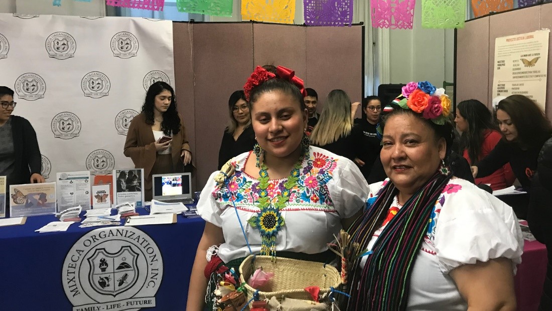 Two women dressed up at an event